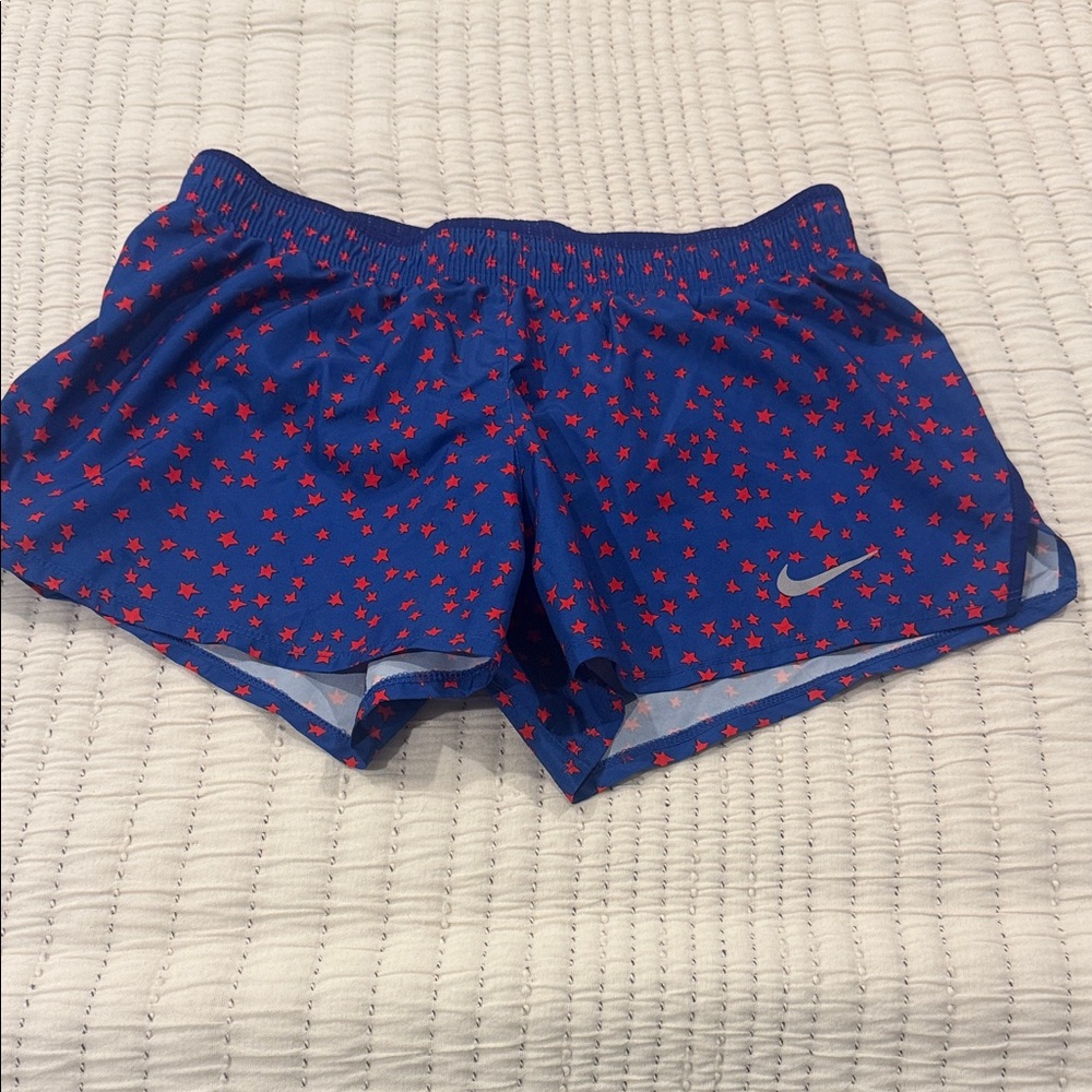 Nike Women's Athletic Shorts with Blue and Red Star Design